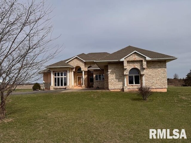 24211 N Carver Rd, Canton, IL 61520 - view of front of property featuring stone siding and a front lawn