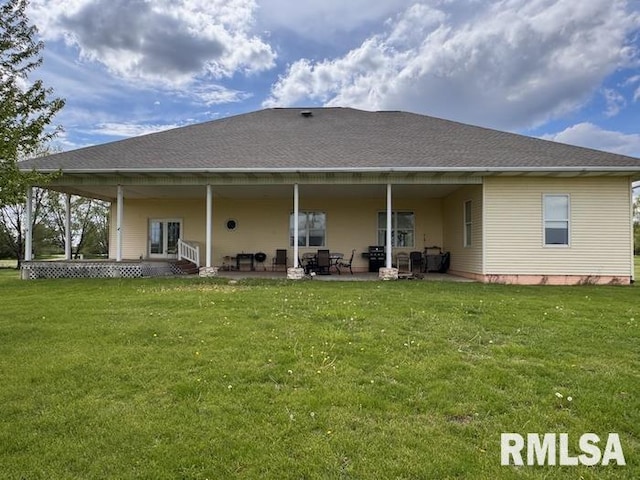 24211 N Carver Rd, Canton, IL 61520 - rear view of property with a lawn and a patio area