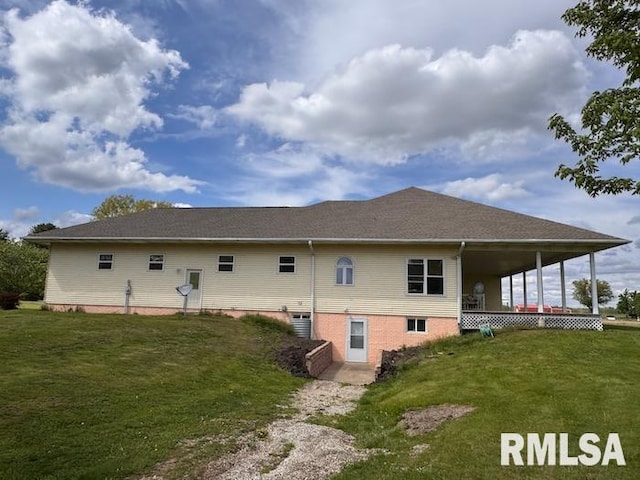 24211 N Carver Rd, Canton, IL 61520 - rear view of house with a yard and cooling unit