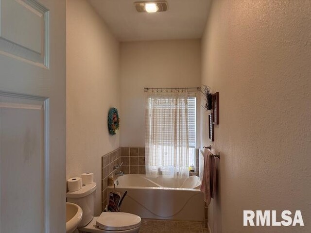 24211 N Carver Rd, Canton, IL 61520 - full bathroom featuring toilet, a bath, and tile patterned floors