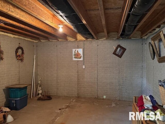 24211 N Carver Rd, Canton, IL 61520 - unfinished below grade area with brick wall