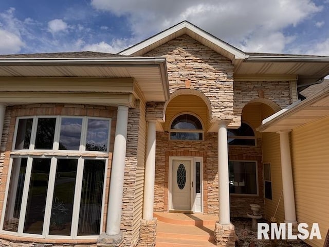 24211 N Carver Rd, Canton, IL 61520 - doorway to property featuring stone siding