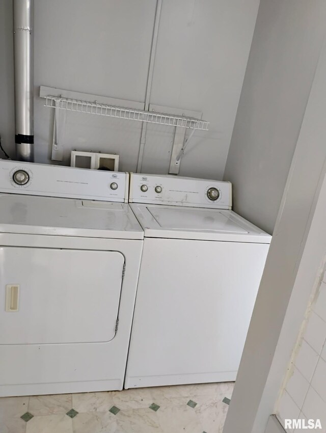 301 Cortland Ave, Avon, IL 61415 - laundry room with independent washer and dryer and marble look tiles
