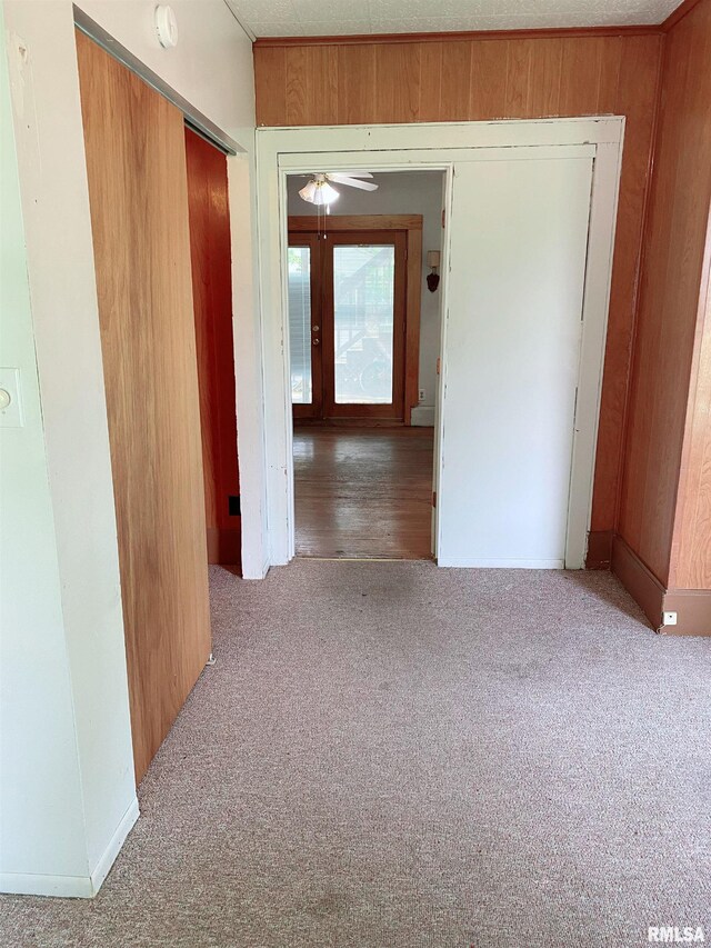 301 Cortland Ave, Avon, IL 61415 - hallway with carpet floors, wood walls, and french doors