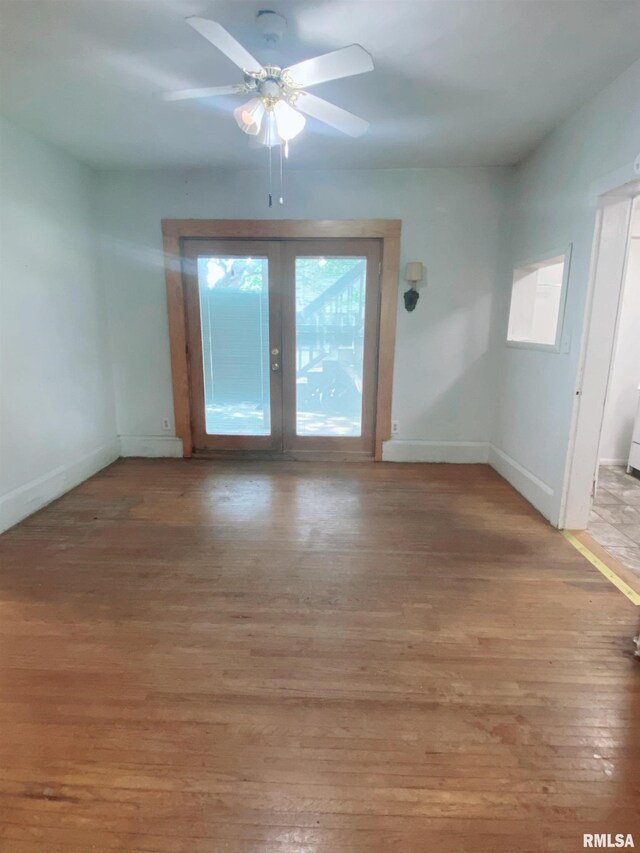 301 Cortland Ave, Avon, IL 61415 - spare room with light wood-type flooring, baseboards, a ceiling fan, and french doors