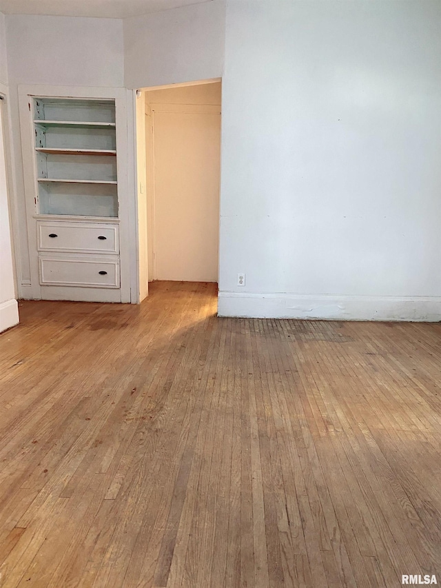 301 Cortland Ave, Avon, IL 61415 - unfurnished bedroom featuring hardwood / wood-style flooring