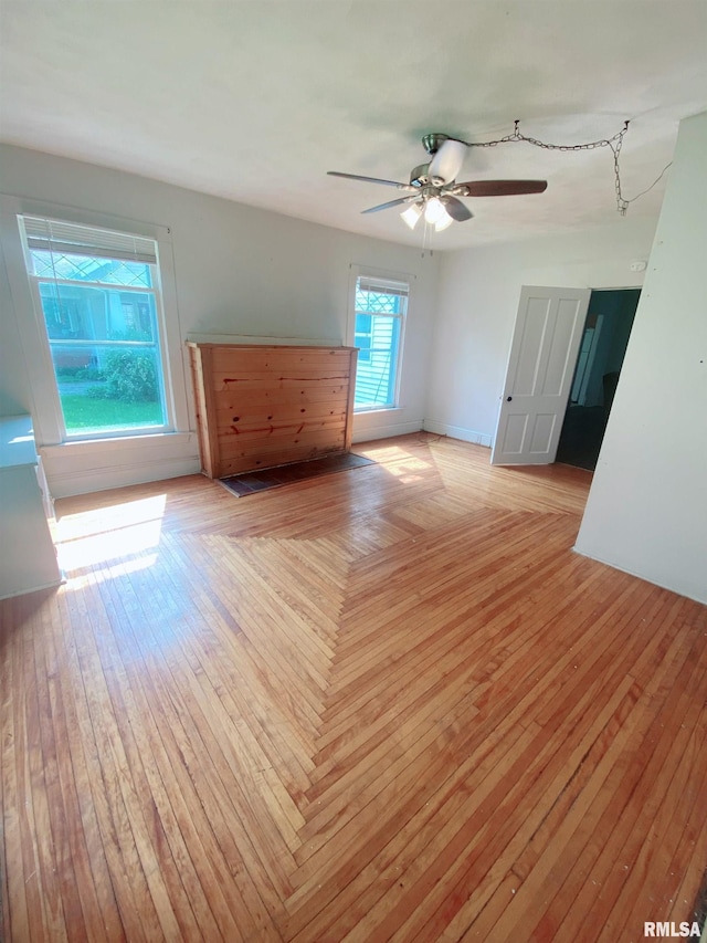 301 Cortland Ave, Avon, IL 61415 - unfurnished room featuring light wood-style flooring and ceiling fan