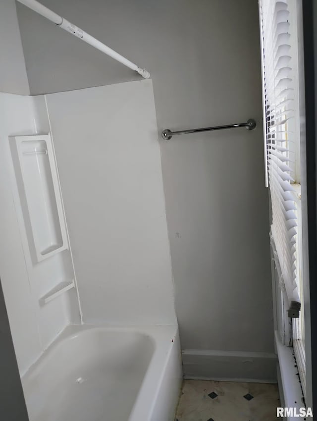 301 Cortland Ave, Avon, IL 61415 - bathroom featuring baseboards, a bath, and a shower