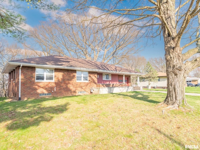 ranch-style house featuring brick siding, a front lawn, and a porch