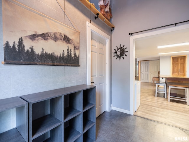 hallway featuring baseboards