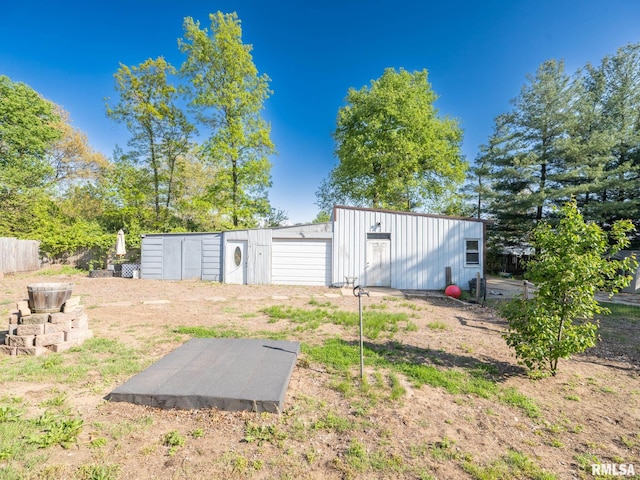 view of yard with an outbuilding and a detached garage