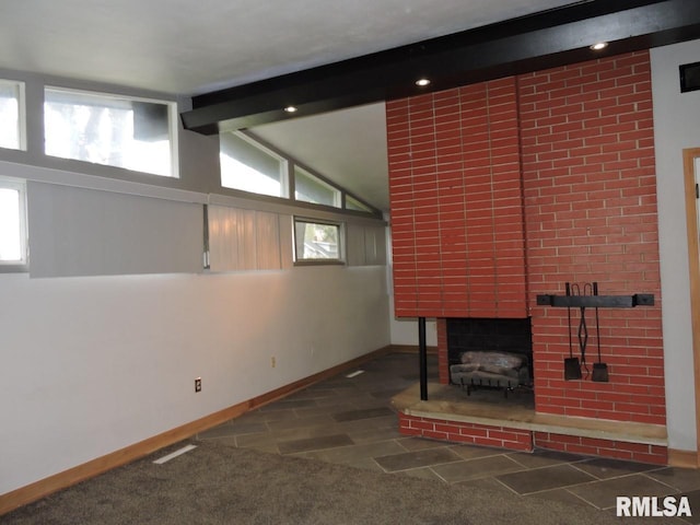 unfurnished living room featuring baseboards, a fireplace, and carpet flooring