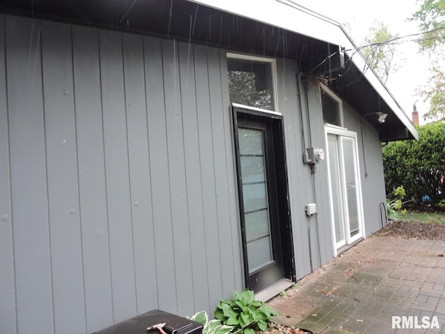 view of side of property featuring a patio area