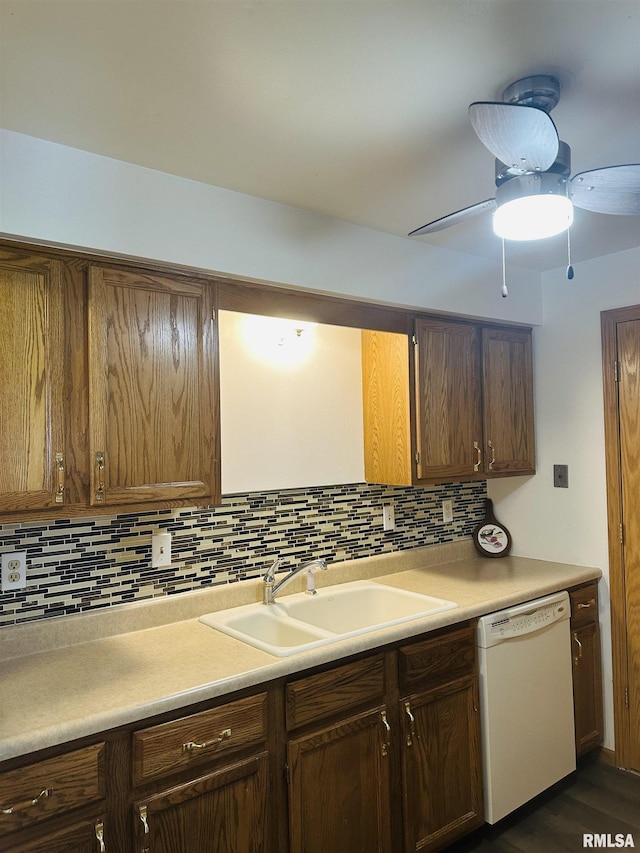 kitchen with a sink, decorative backsplash, a ceiling fan, and dishwasher