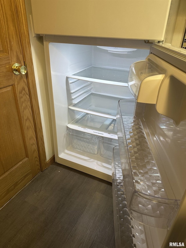 details with wood finished floors and refrigerator