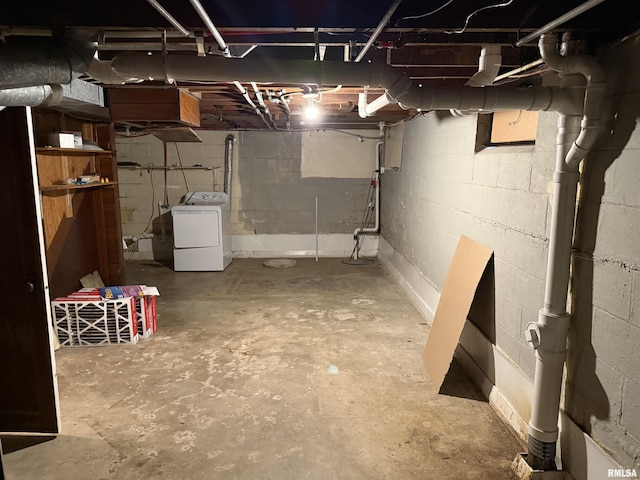 unfinished basement with washer / clothes dryer