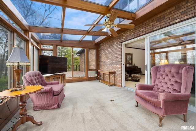 sunroom / solarium with brick wall, a skylight, beamed ceiling, and carpet floors