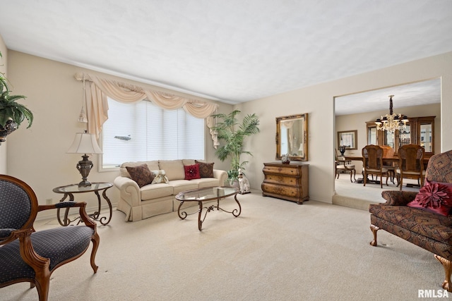living room with carpet, a chandelier, and baseboards