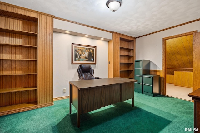 office with ornamental molding, carpet, wooden walls, and built in features