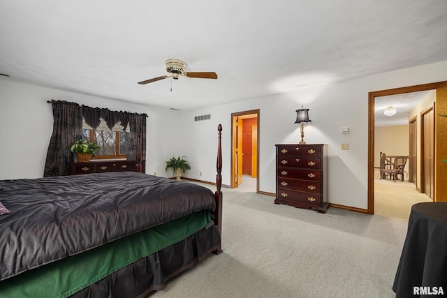 bedroom with carpet, visible vents, and baseboards