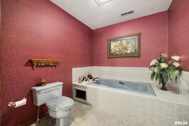 bathroom with vaulted ceiling, a bath, toilet, and visible vents