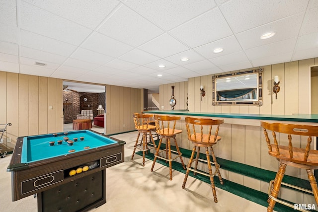 rec room with recessed lighting, a paneled ceiling, a dry bar, and carpet floors