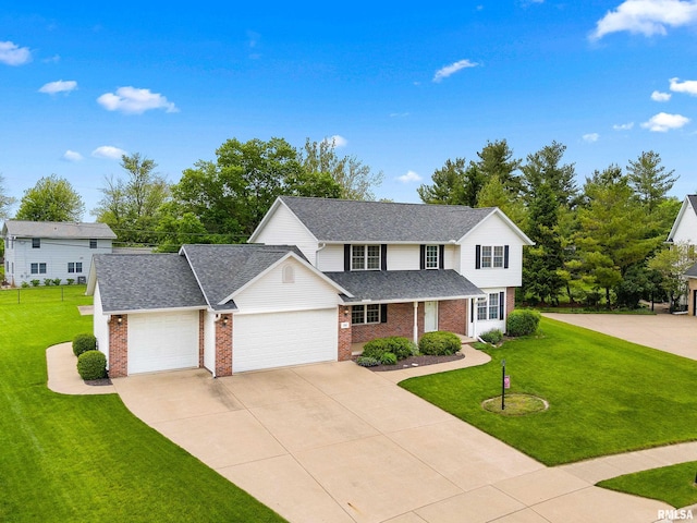 traditional-style house featuring brick siding, a garage, a front yard, and concrete driveway