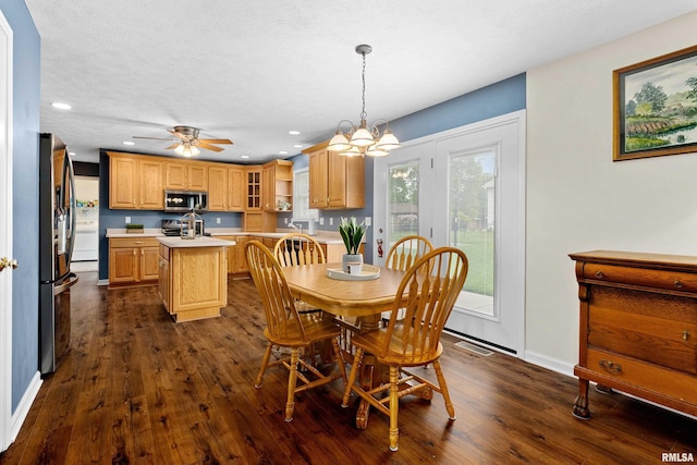 dining room featuring dark wood-style floors, recessed lighting, a chandelier, baseboards, and a ceiling fan