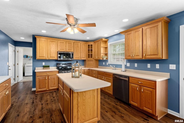 kitchen with stainless steel appliances, washer / clothes dryer, a ceiling fan, light countertops, and a sink
