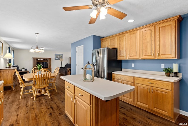kitchen with stainless steel refrigerator with ice dispenser, light countertops, dark wood-style flooring, a ceiling fan, and recessed lighting
