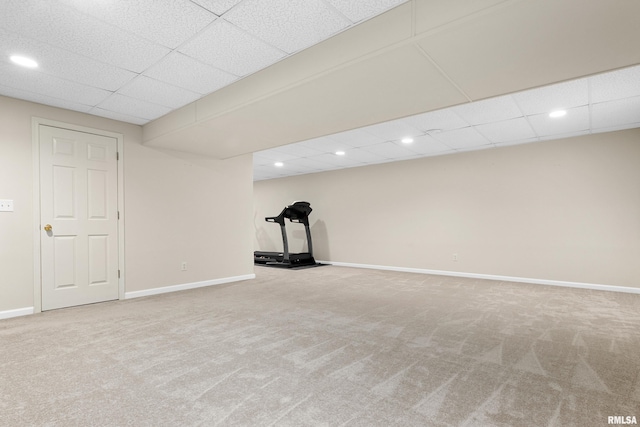 exercise area with carpet, a drop ceiling, recessed lighting, and baseboards