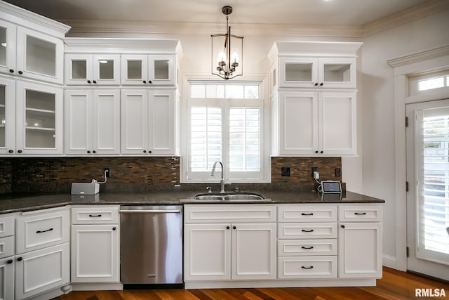 kitchen with a sink, a chandelier, white cabinets, and dishwasher