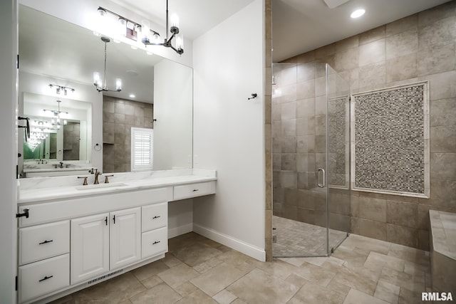 full bath featuring vanity, visible vents, recessed lighting, a shower stall, and baseboards