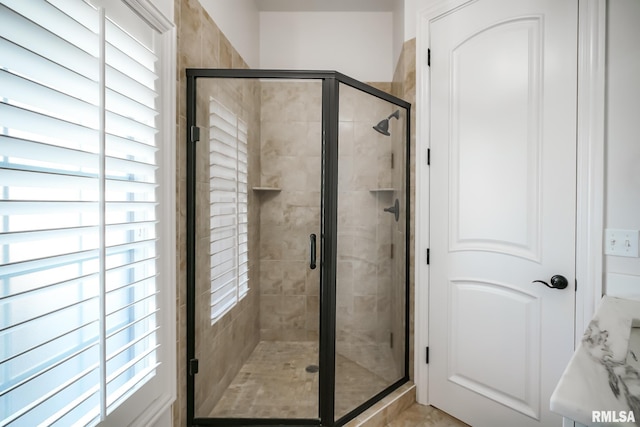 bathroom with a stall shower