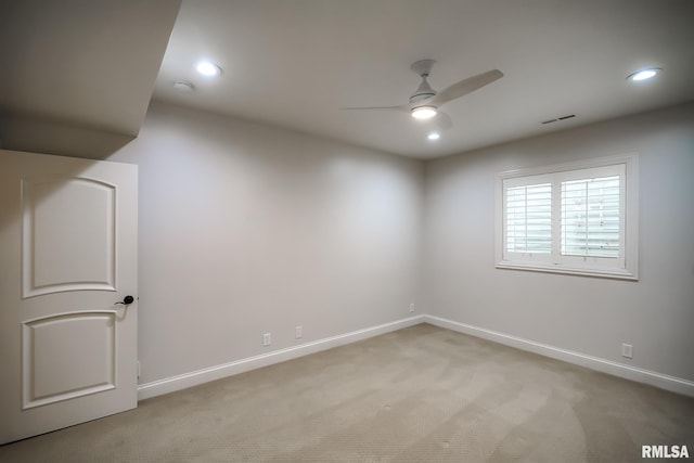 spare room featuring visible vents, recessed lighting, ceiling fan, light carpet, and baseboards