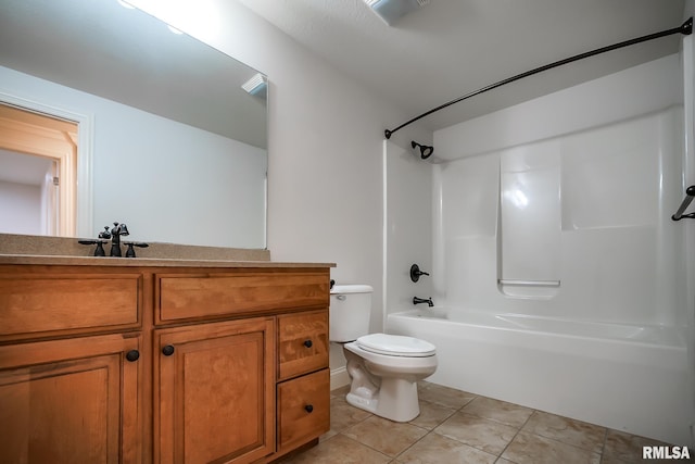 full bathroom with tile patterned floors, toilet, vanity, and washtub / shower combination