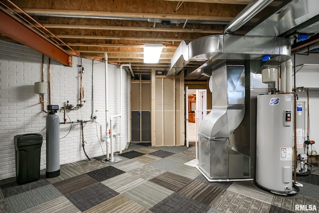 unfinished below grade area with electric water heater, heating unit, and carpet floors
