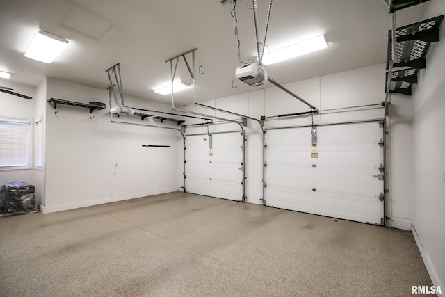 garage featuring baseboards and a garage door opener
