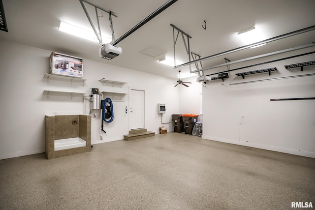 garage with baseboards and a garage door opener