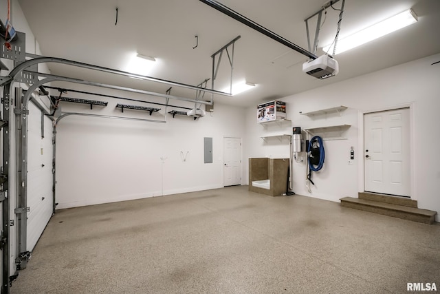 garage featuring electric panel and a garage door opener