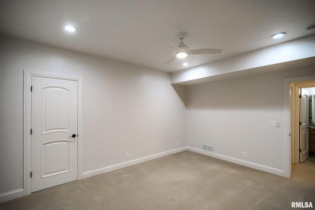 below grade area featuring visible vents, recessed lighting, light carpet, a ceiling fan, and baseboards