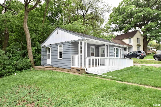 420 W Garfield Ave, Bartonville, IL 61607 - view of front of house featuring a porch and a front yard
