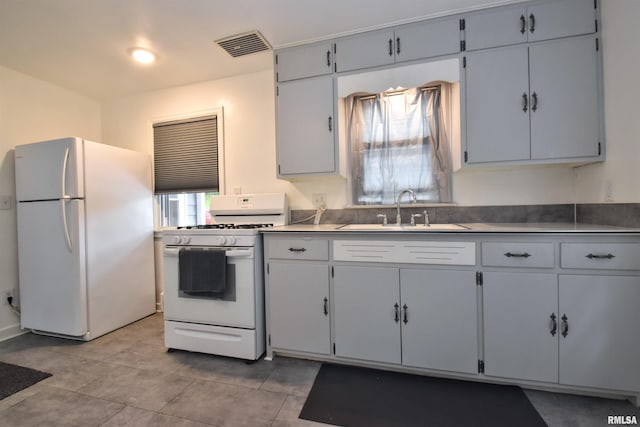 420 W Garfield Ave, Bartonville, IL 61607 - kitchen with white appliances and a sink