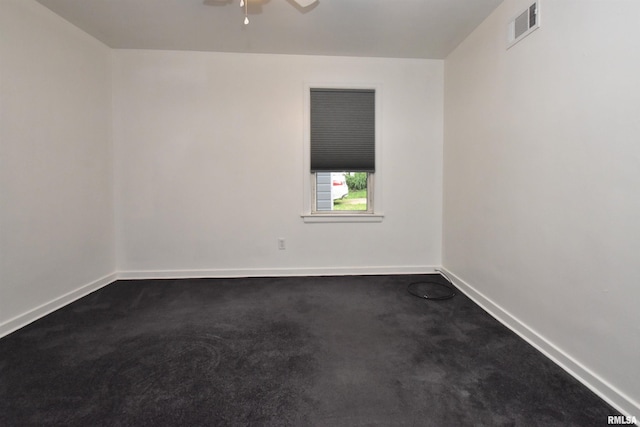 420 W Garfield Ave, Bartonville, IL 61607 - spare room featuring dark colored carpet, baseboards, and a ceiling fan