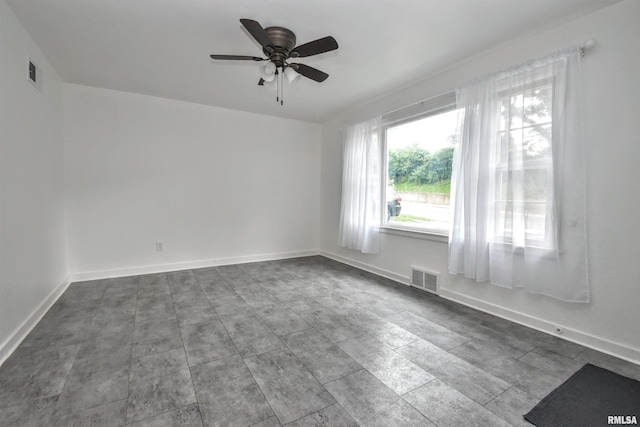 420 W Garfield Ave, Bartonville, IL 61607 - spare room featuring ceiling fan and baseboards