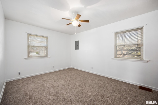 1420 N 10th St, Pekin, IL 61554 - spare room with baseboards, carpet flooring, ceiling fan, and electric panel