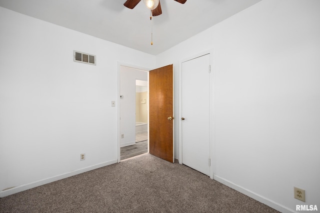 1420 N 10th St, Pekin, IL 61554 - carpeted spare room with ceiling fan, baseboards, and visible vents