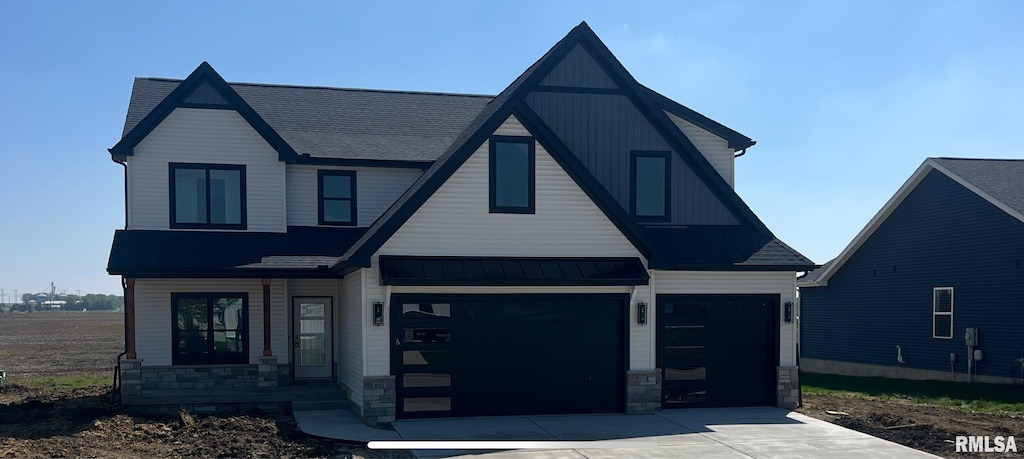view of front of property featuring concrete driveway, stone siding, a shingled roof, and an attached garage