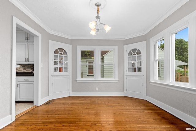 2714 W Kenwood Ave, West Peoria, IL 61604 - unfurnished sunroom featuring a chandelier
