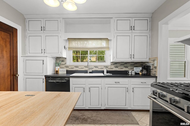 2714 W Kenwood Ave, West Peoria, IL 61604 - kitchen with black dishwasher, gas stove, a sink, and decorative backsplash